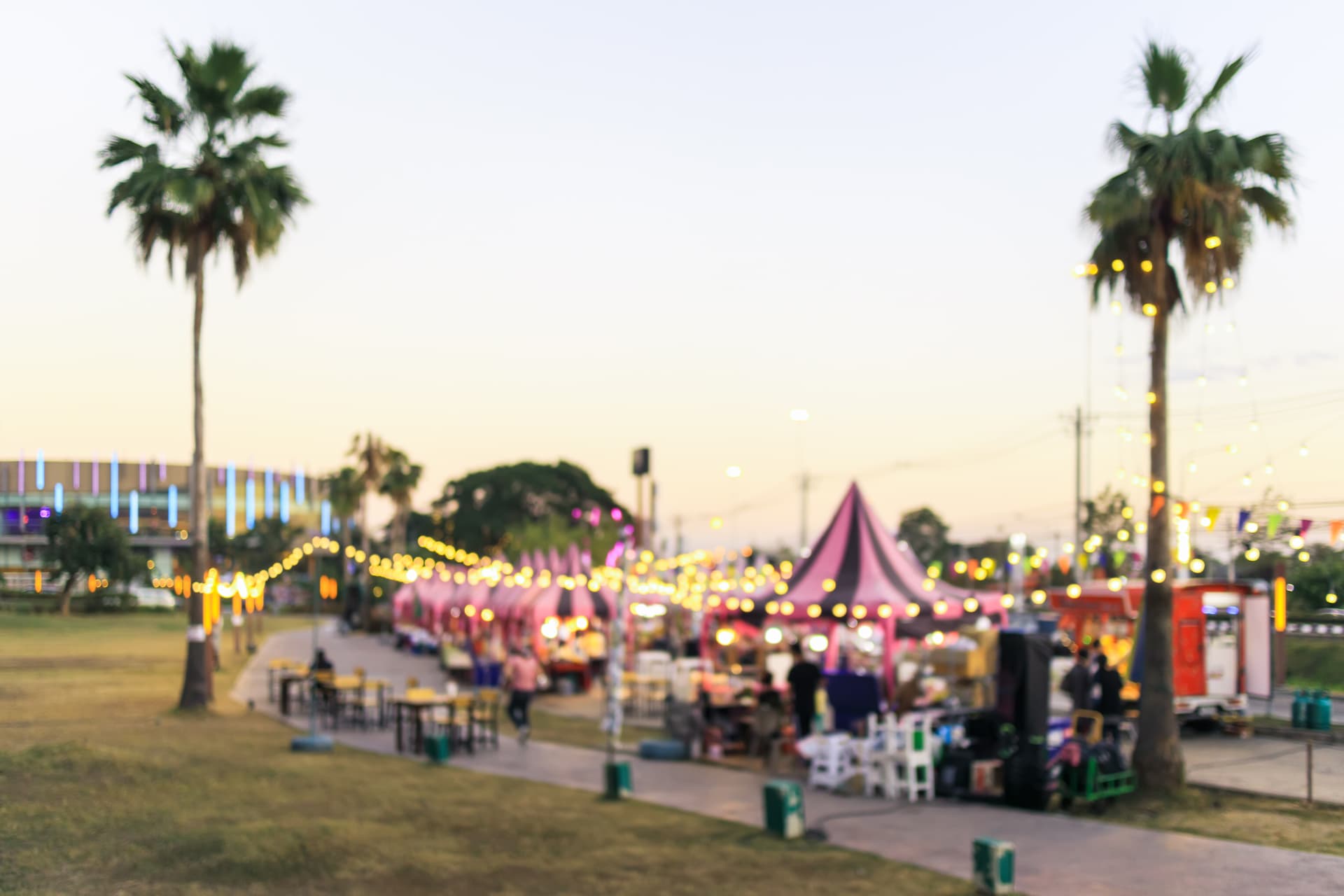 Outdoor market at dusk under string lights